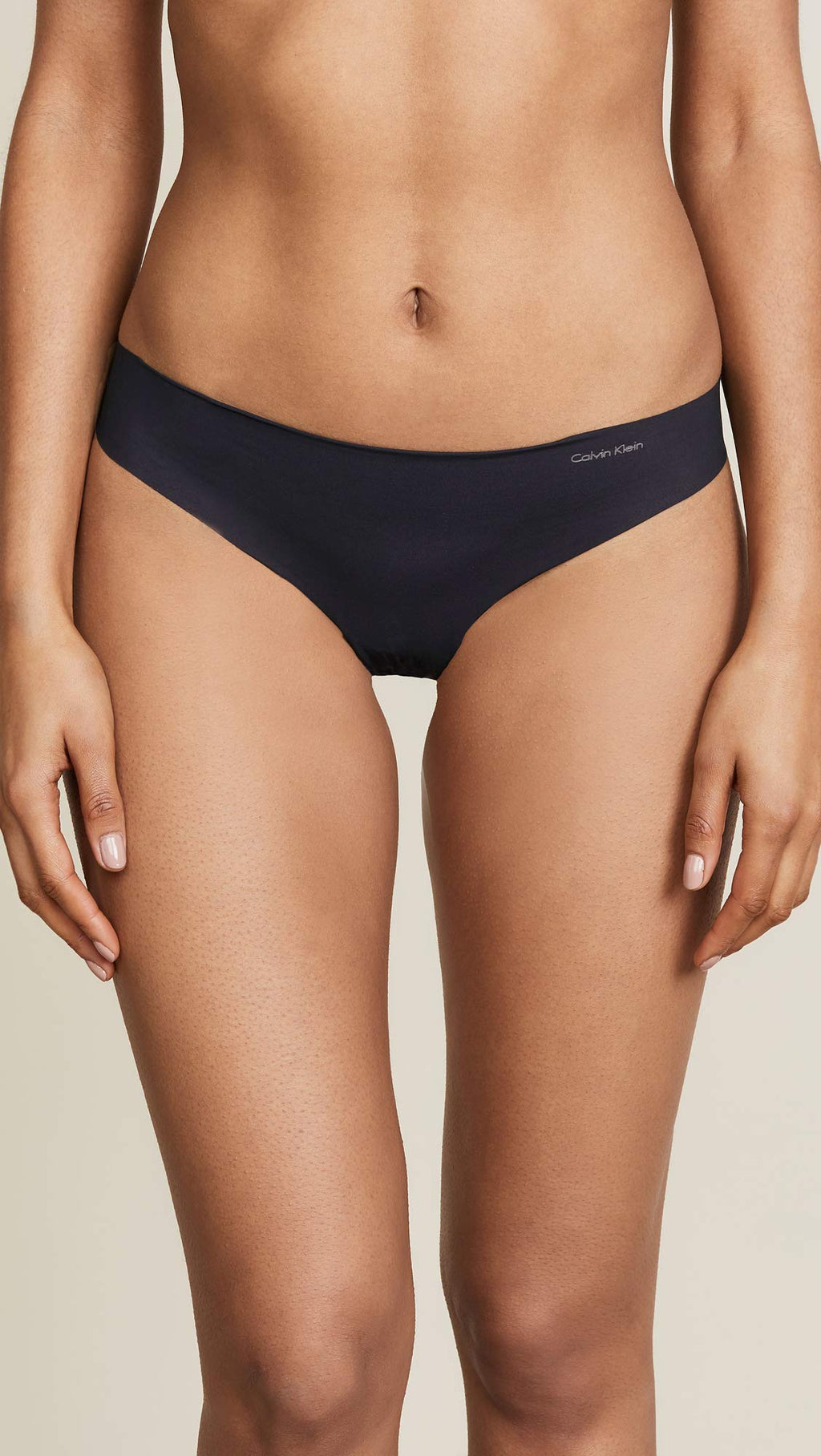 Calvin Klein Women's Invisibles Seamless Thong Panty, Black, Large