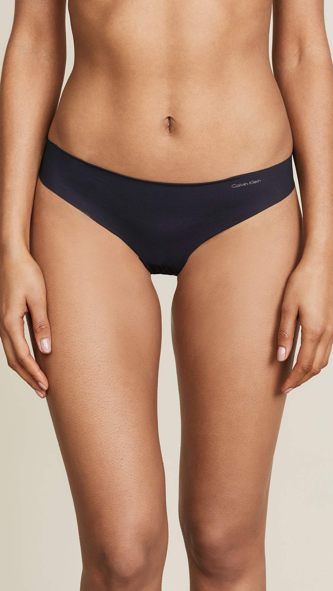 Calvin Klein Women's Invisibles Seamless Thong Panty, Black, Large